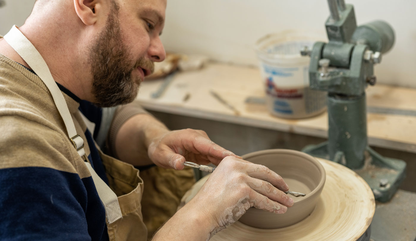 Man making pottery art, clay work close up hands shot shot Stock