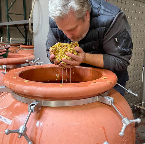 Craig Weicker sniffs skin-contact riesling that will be blended with gewurztraminer and pinot gris to become an amphora-fermented and aged orange wine.
