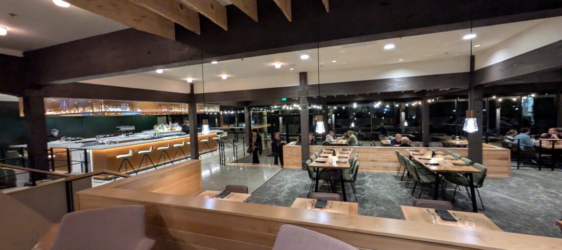 A wall of windows in the dining room of Sweet Waters on the River at Valley River Inn in Eugene, Oregon. 